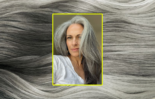 woman wearing grey hair extensions against grey hair macro image background