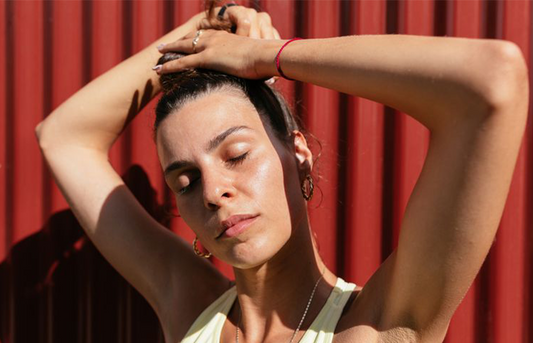 woman dealing with excessive hair shedding while doing an updo